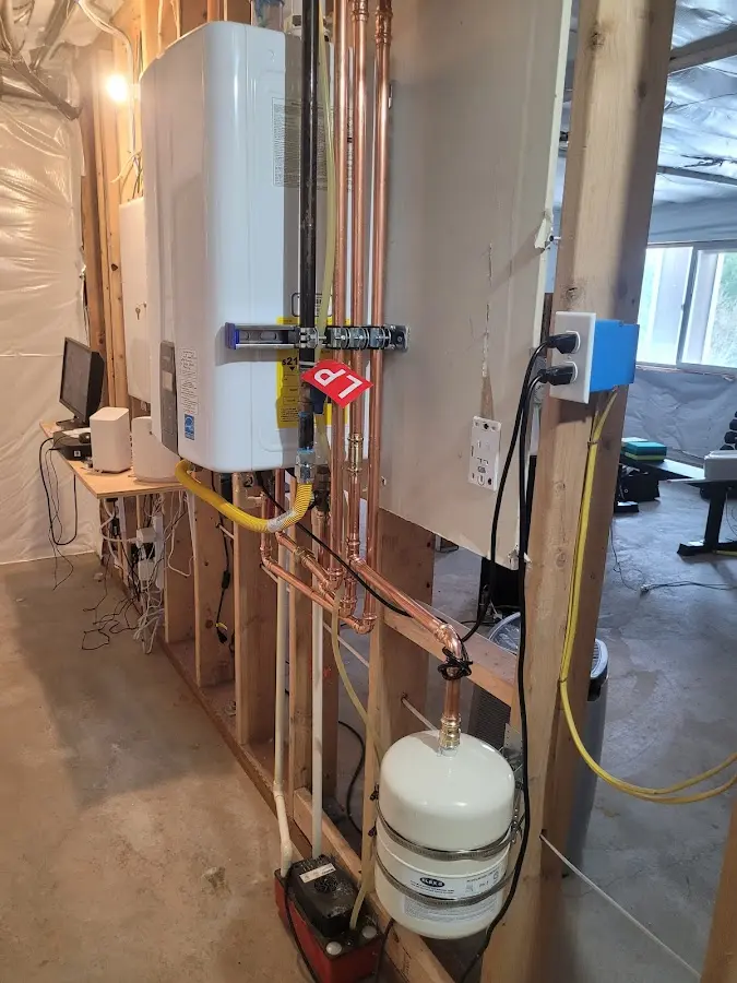 Licensed plumber repairing a kitchen sink in Edgemoor